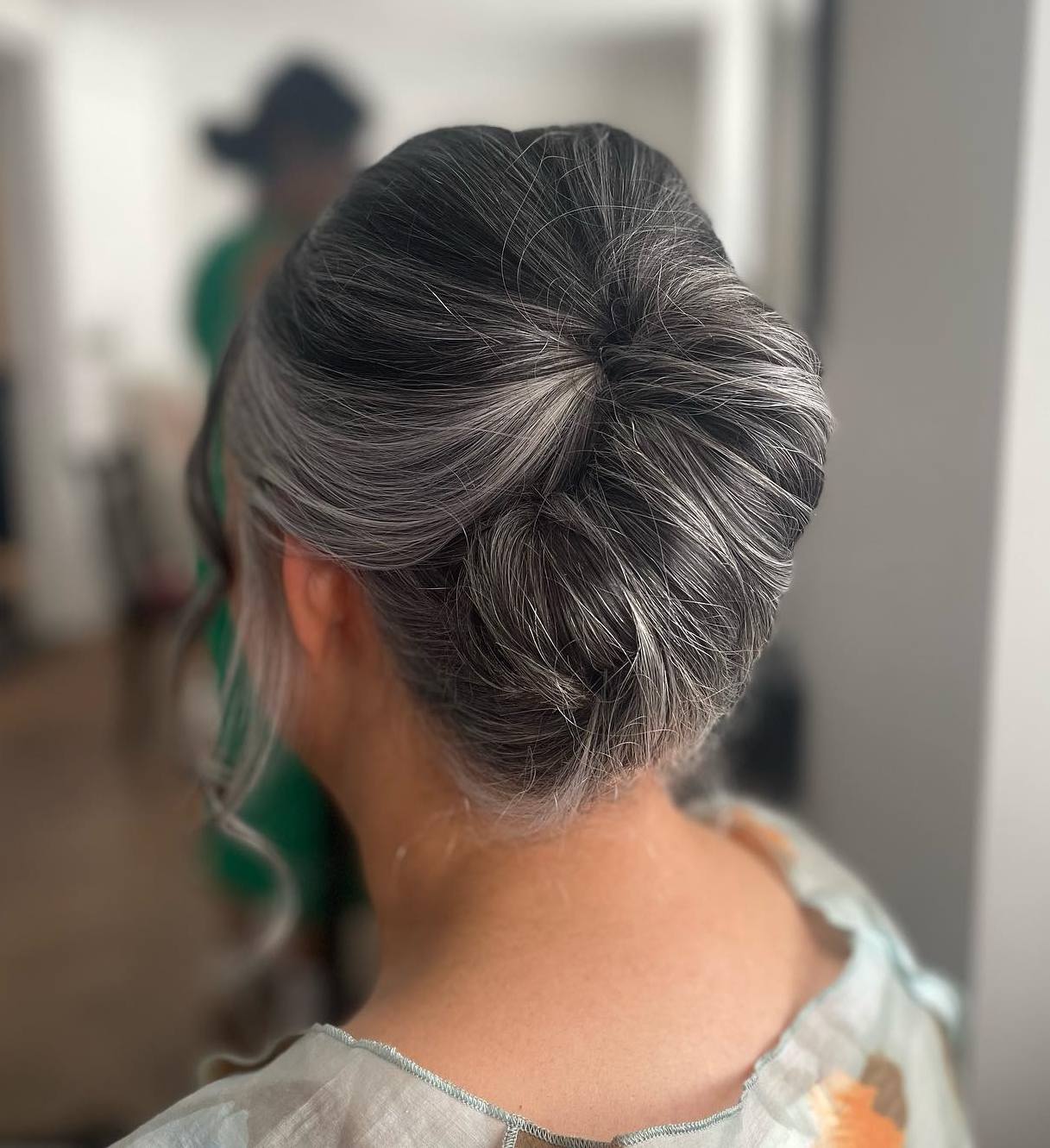 Delicate French Roll on Salt-and-Pepper Hair